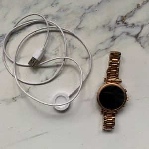 Fossil watch with charging cable